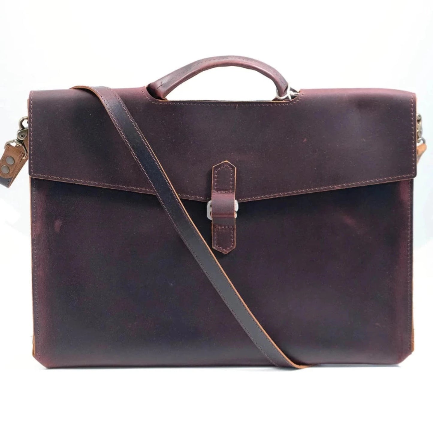 The Diplomat Attaché functions as a carry tool for a laptop, wallet, cell phone, and all your other accessories. It can be carried at your side by its reinforced leather handle or cross-body with the included shoulder strap for a sleek appearance. The top grain leather will keep your gear well protected while looking better over time.