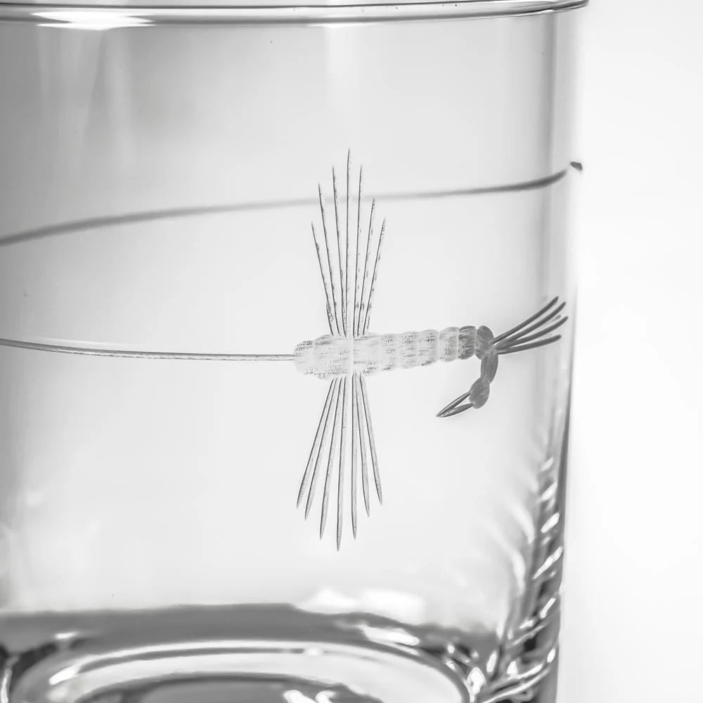 Experience the perfect blend of elegance and adventure with our Fly Fishing Double Old Fashioned Whiskey Glass. Each glass is meticulously crafted with a delicate fly cast design, engraved using diamond-wheel technology. This unique glass is an ideal choice for outdoor enthusiasts and nature lovers. Whether you're toasting to a successful fishing trip or enjoying a quiet evening at home, this glass adds a touch of sophistication to any occasion