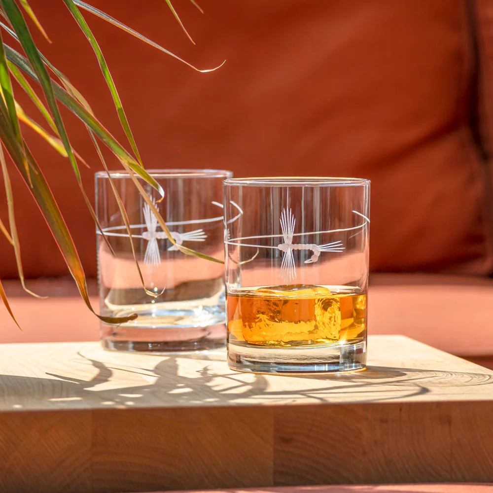 Experience the perfect blend of elegance and adventure with our Fly Fishing Double Old Fashioned Whiskey Glass. Each glass is meticulously crafted with a delicate fly cast design, engraved using diamond-wheel technology. This unique glass is an ideal choice for outdoor enthusiasts and nature lovers. Whether you're toasting to a successful fishing trip or enjoying a quiet evening at home, this glass adds a touch of sophistication to any occasion