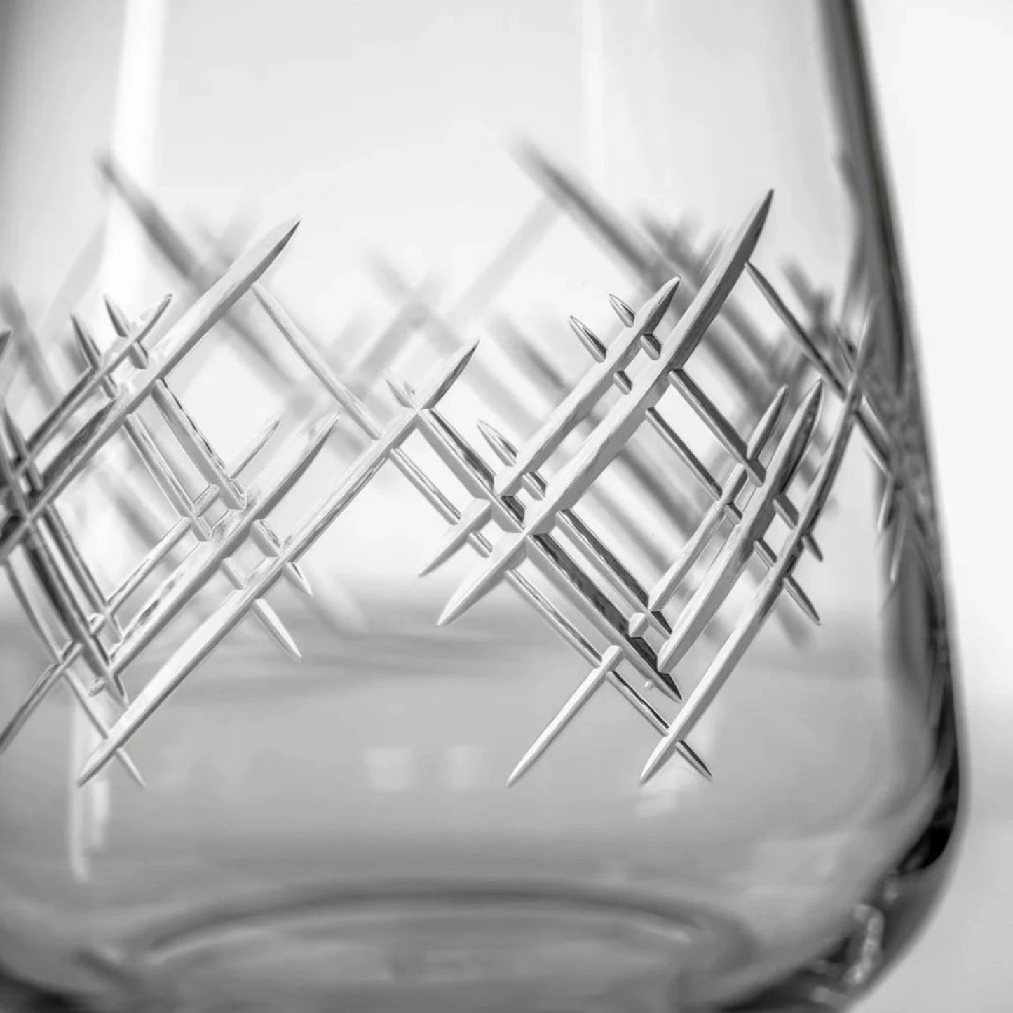 Experience the elegance of the Argyle 15.75oz Stemless Wine Glass, a timeless design inspired by the tartans of the Clan Cambell of Argyll, Scotland in the 17th century. This classic diamond pattern became an iconic symbol of British fashion after the Duke of Windsor adopted it in the 1920s. Crafted by Rolf Glass, each piece is a testament to the enduring appeal of the Argyle pattern. Elevate your wine tasting experience with this sophisticated and stylish wine glass.