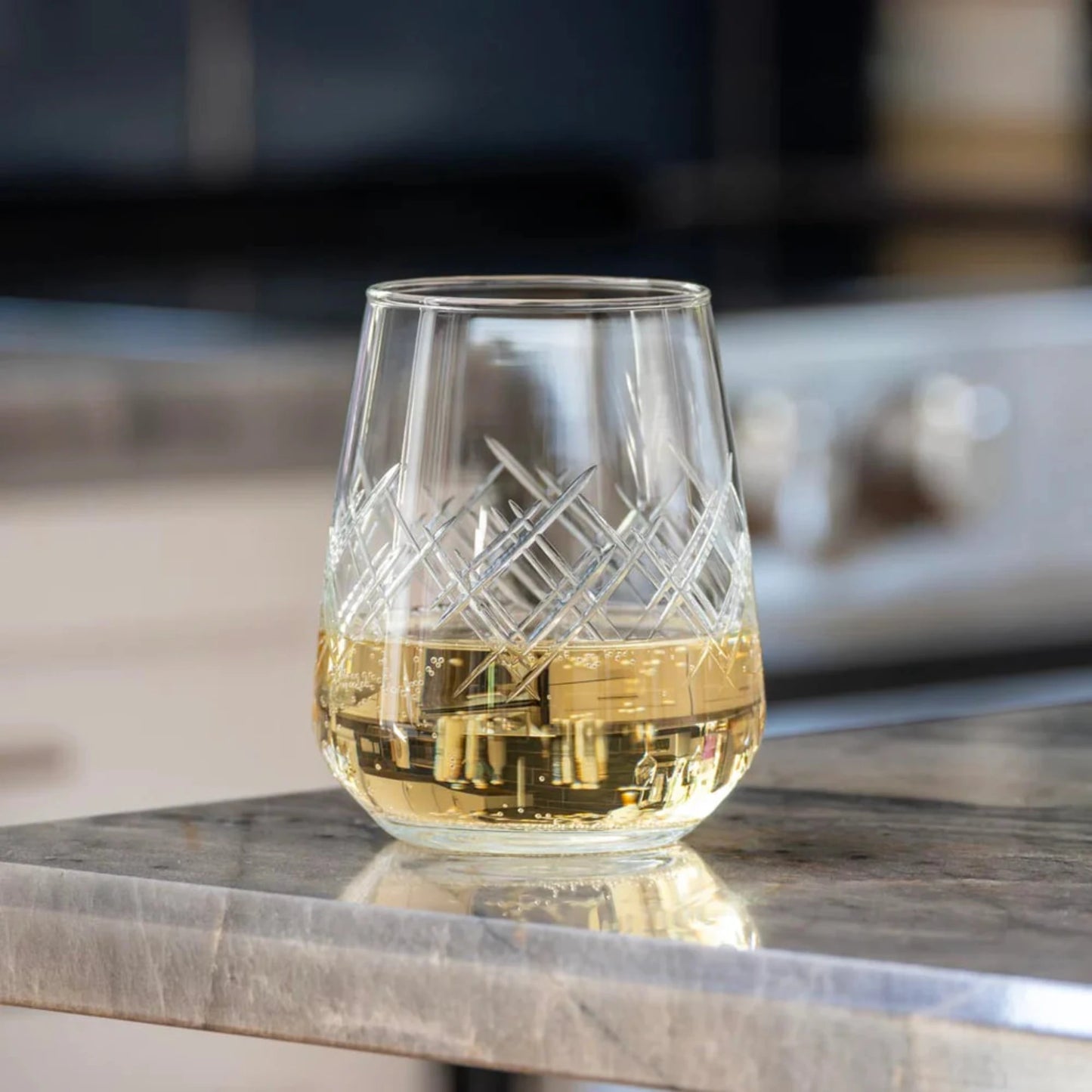 Experience the elegance of the Argyle 15.75oz Stemless Wine Glass, a timeless design inspired by the tartans of the Clan Cambell of Argyll, Scotland in the 17th century. This classic diamond pattern became an iconic symbol of British fashion after the Duke of Windsor adopted it in the 1920s. Crafted by Rolf Glass, each piece is a testament to the enduring appeal of the Argyle pattern. Elevate your wine tasting experience with this sophisticated and stylish wine glass.
