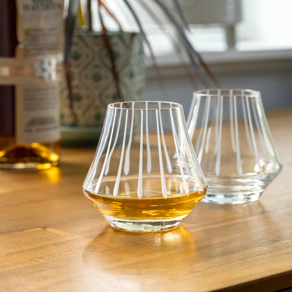 Indulge in your favorite whiskey with the Rolf Glass Modern Whiskey Glass. Each glass is expertly crafted with the finest materials to provide a luxurious drinking experience.
Featuring a sleek and modern design, these glasses are perfect for serving up your favorite whiskey neat, on the rocks, or in a classic cocktail. Their sturdy construction and perfect size make them an ideal addition to any home bar or table setting.
Made in the USA and dishwasher safe for easy cleanup, the Rolf Glass Modern Whiskey