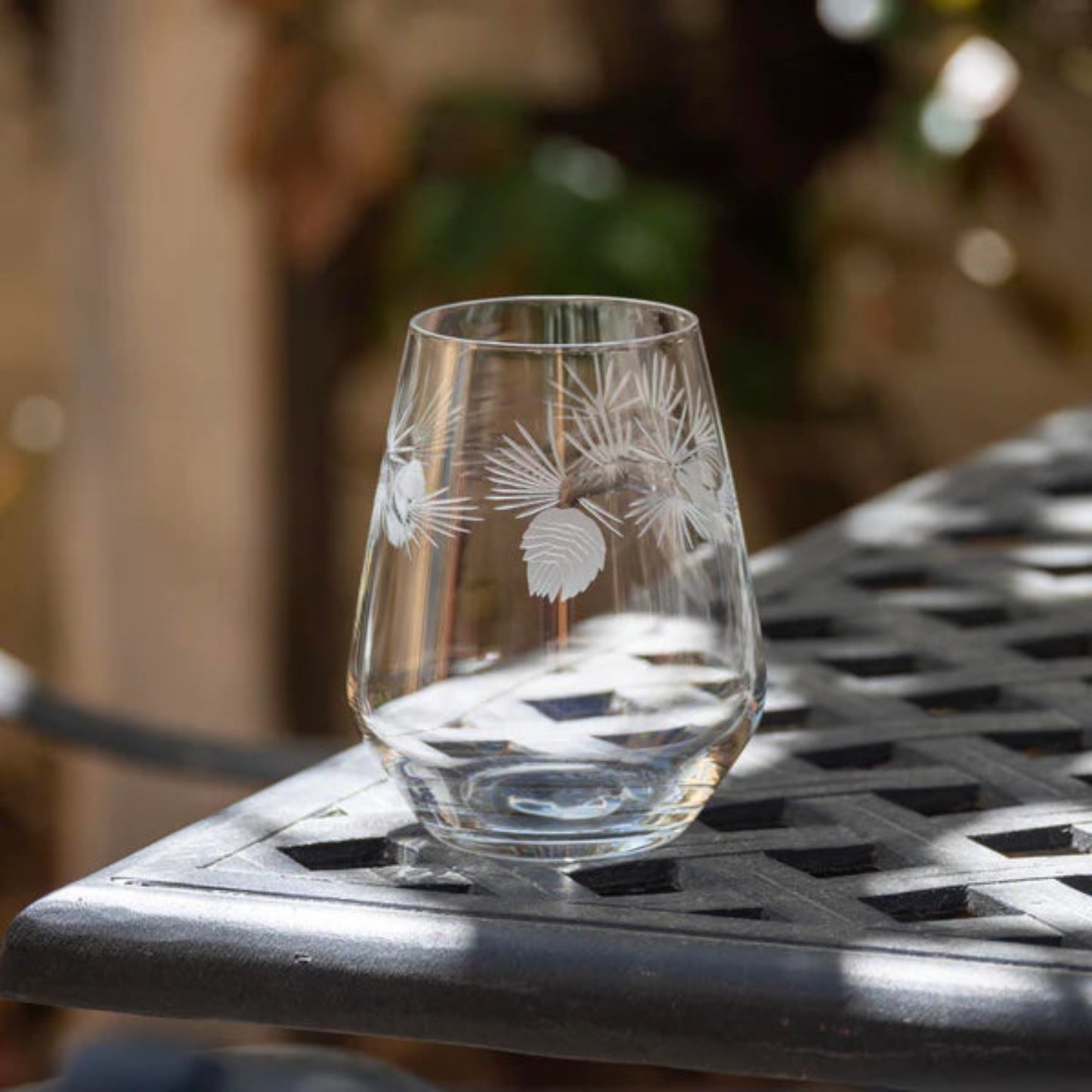 Nothing represents the great outdoors like an evergreen tree. This delightful, multi-facetted Icy Pine glassware collection by Rolf Glass brings the outdoors to your table. Contrasting pine needles are diamond-wheel engraved and brilliantly polished to add dimension and sparkle. American made, these decorated glasses are ideal for any occasion from your holiday table to your picnic table.