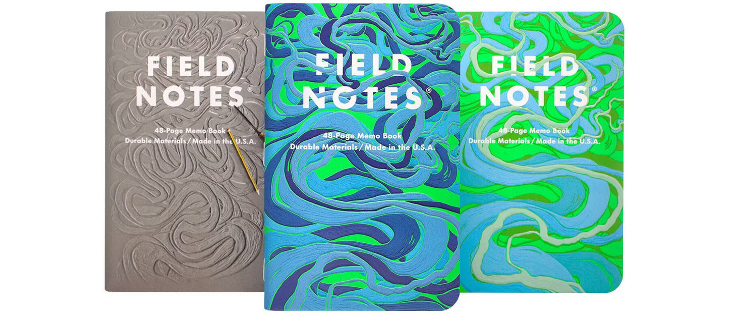 Three Field Notes memo books with different covers, one with an embossed pattern, and two with a geometric and organic design, respectively.