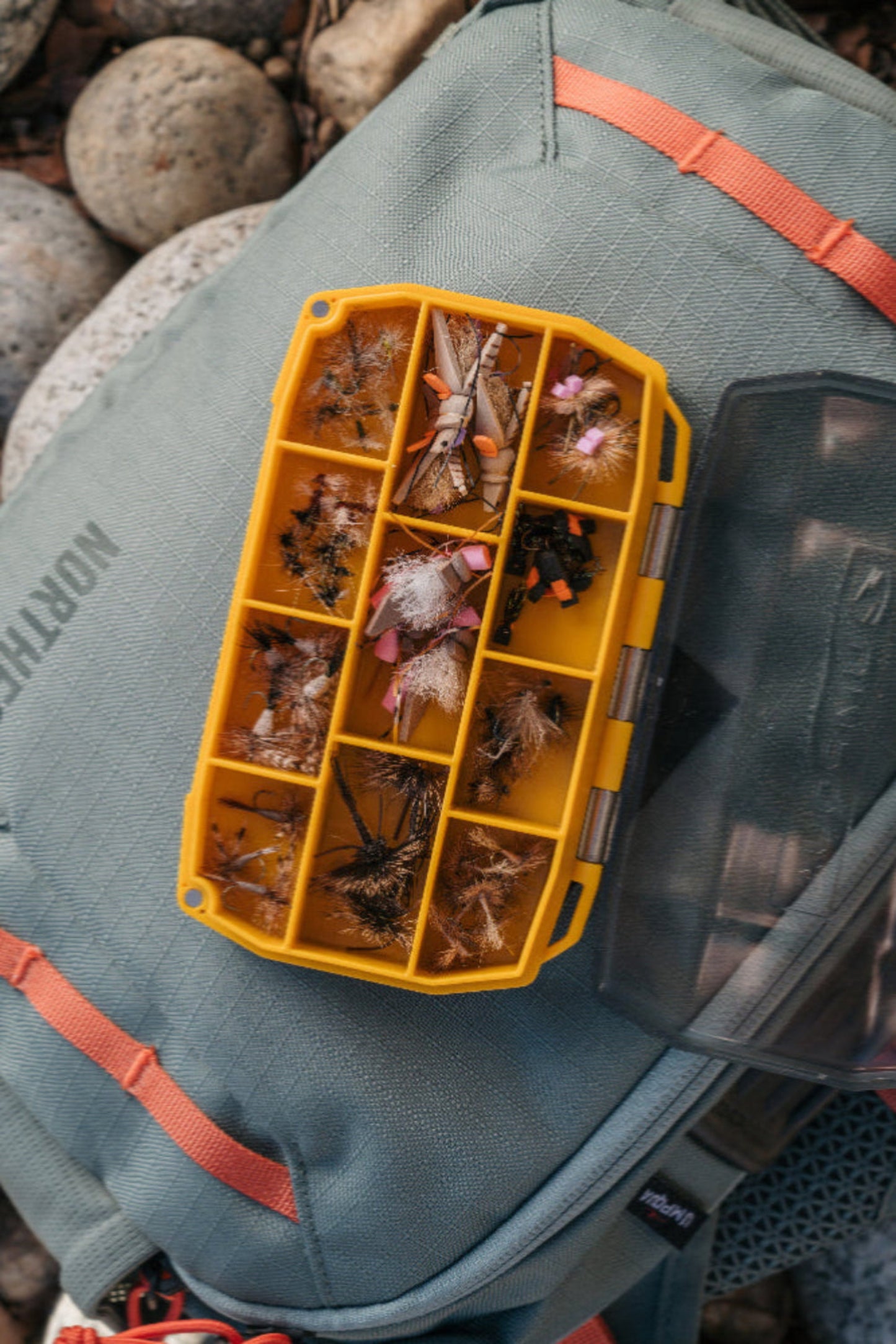 Quick access, effortless organization, and zero guesswork—the UPG Compartment Box is built for anglers who need their go-to patterns ready at a glance.
With 11 secure compartments and a clear lid, this box keeps a variety of flies neatly sorted and instantly visible, eliminating the frustration of digging through clutter.
Whether you’re storing match-the-hatch staples, trusted favorites, or fresh-off-the-vise creations, this box makes organization seamless.
It’s simple and efficient —the UPG Compart
