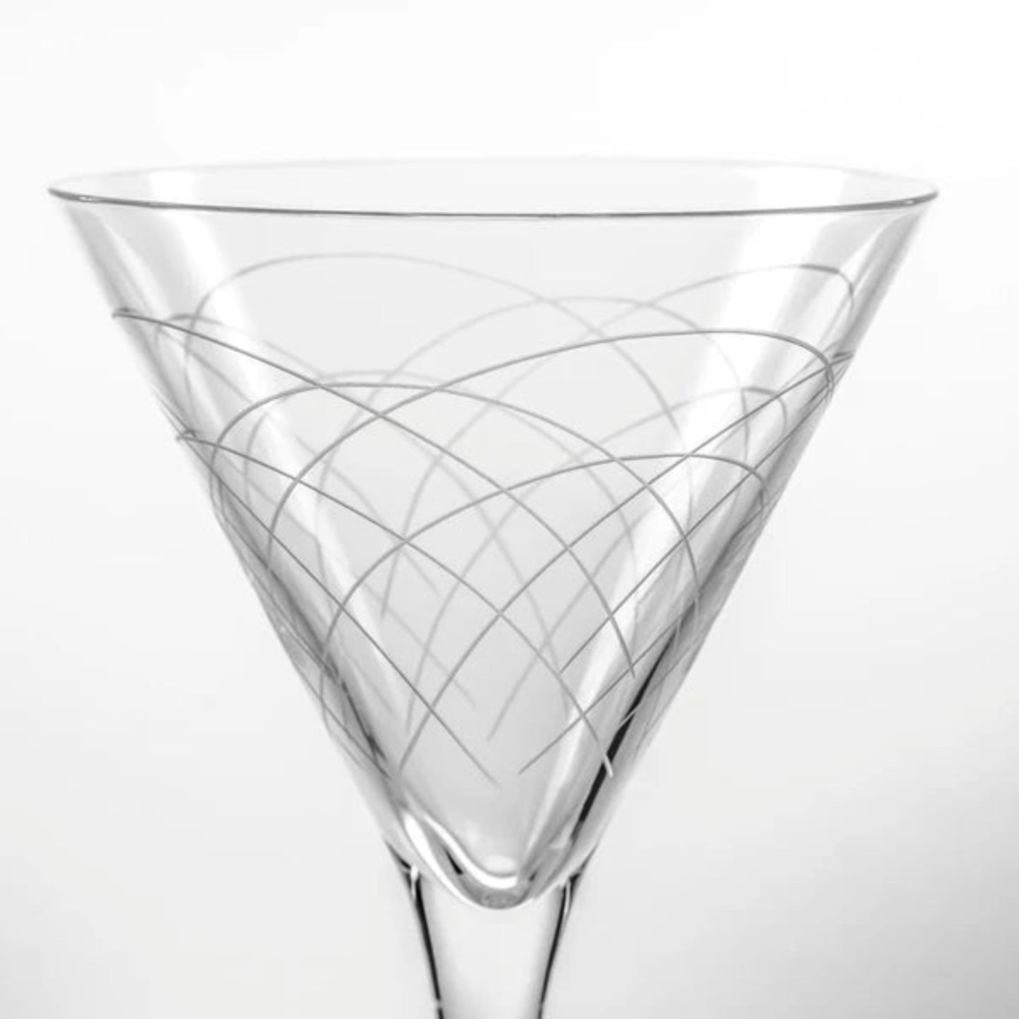 Step back in time with our Mid-Century Modern 7.5oz Martini Cocktail Glass. Crafted with the finest materials and featuring unique geometric designs inspired by the iconic mid-century modern era, this glass is the perfect vessel for your favorite cocktails. Whether you prefer your martini shaken or stirred, this glass adds a touch of retro elegance to any bar or table setting. Made in the USA and dishwasher safe, it's the perfect addition to your cocktail collection.
