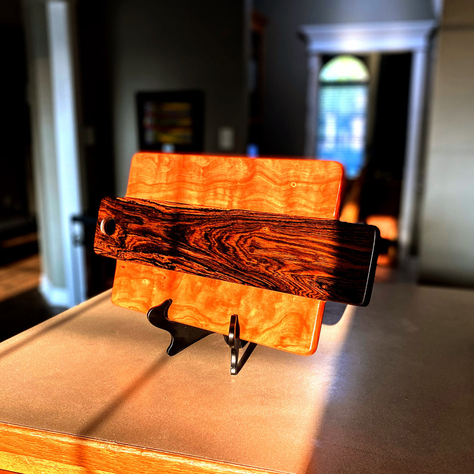 This Charcuterie Board has been expertly handcrafted with Bocote and Curly Cherry, measuring 21