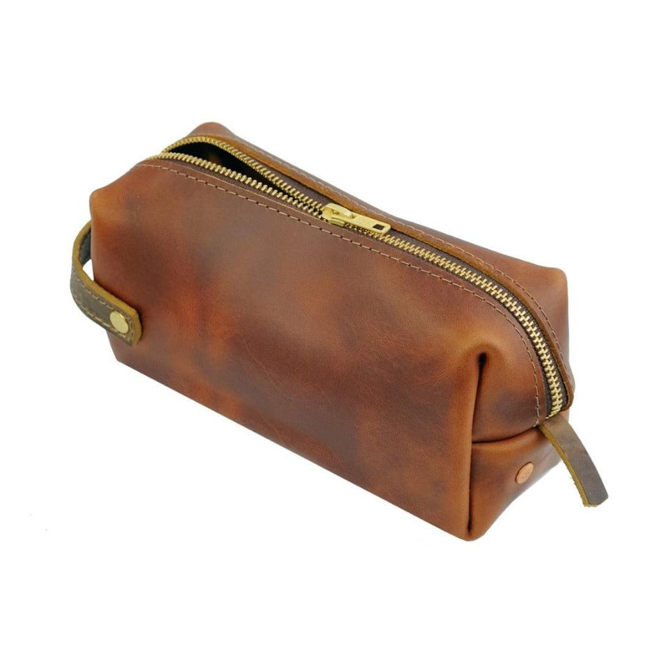 Experience luxury and reliability with High Line Leather Pouch. Crafted with premium-grade leather and robust brass zippers, this pouch comes in three sizes to suit your lifestyle. Whether for the office, an outdoor adventure, or traveling the globe, this pouch will keep your things protected and stylishly stored.