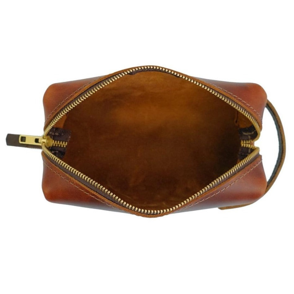 Experience luxury and reliability with High Line Leather Pouch. Crafted with premium-grade leather and robust brass zippers, this pouch comes in three sizes to suit your lifestyle. Whether for the office, an outdoor adventure, or traveling the globe, this pouch will keep your things protected and stylishly stored.
