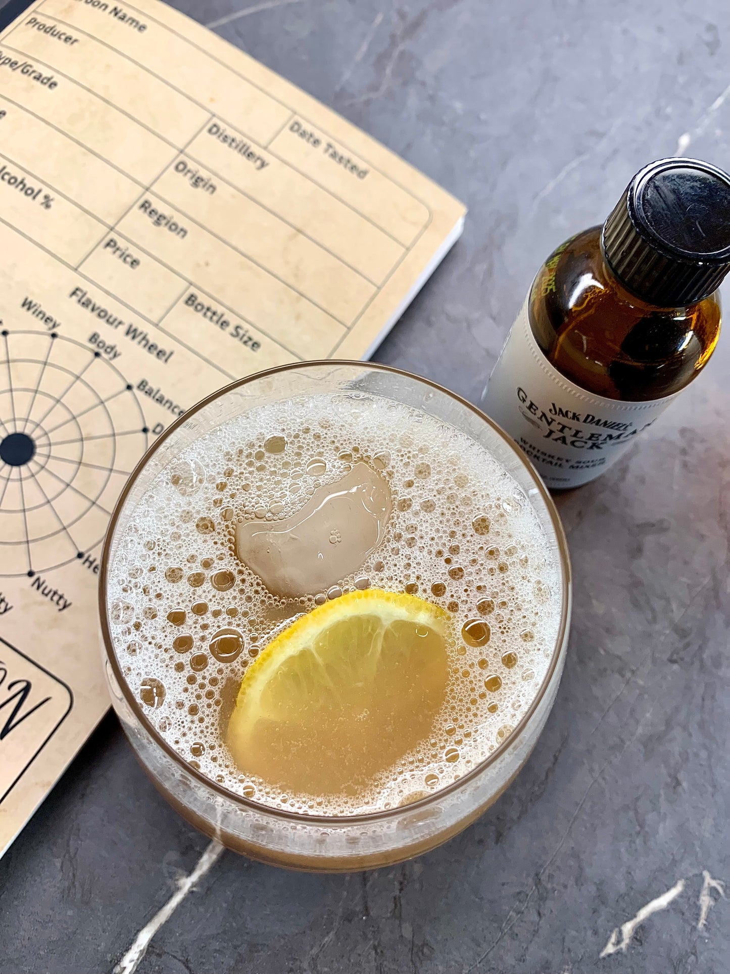 Whiskey Sour cocktail with a twist of citrus, perfect for summer evenings.