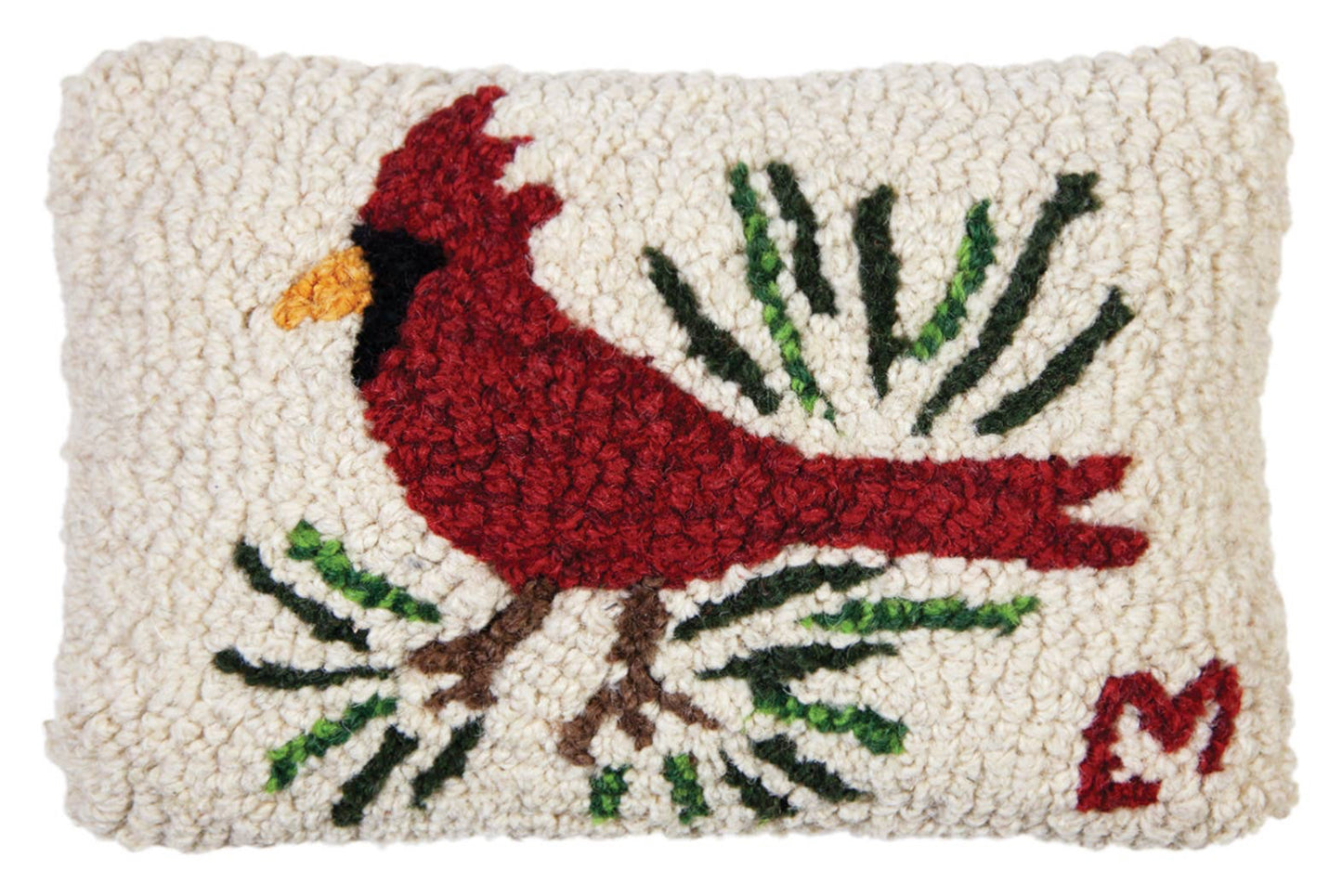 Decorative pillow with a red cardinal and green branches on a white background