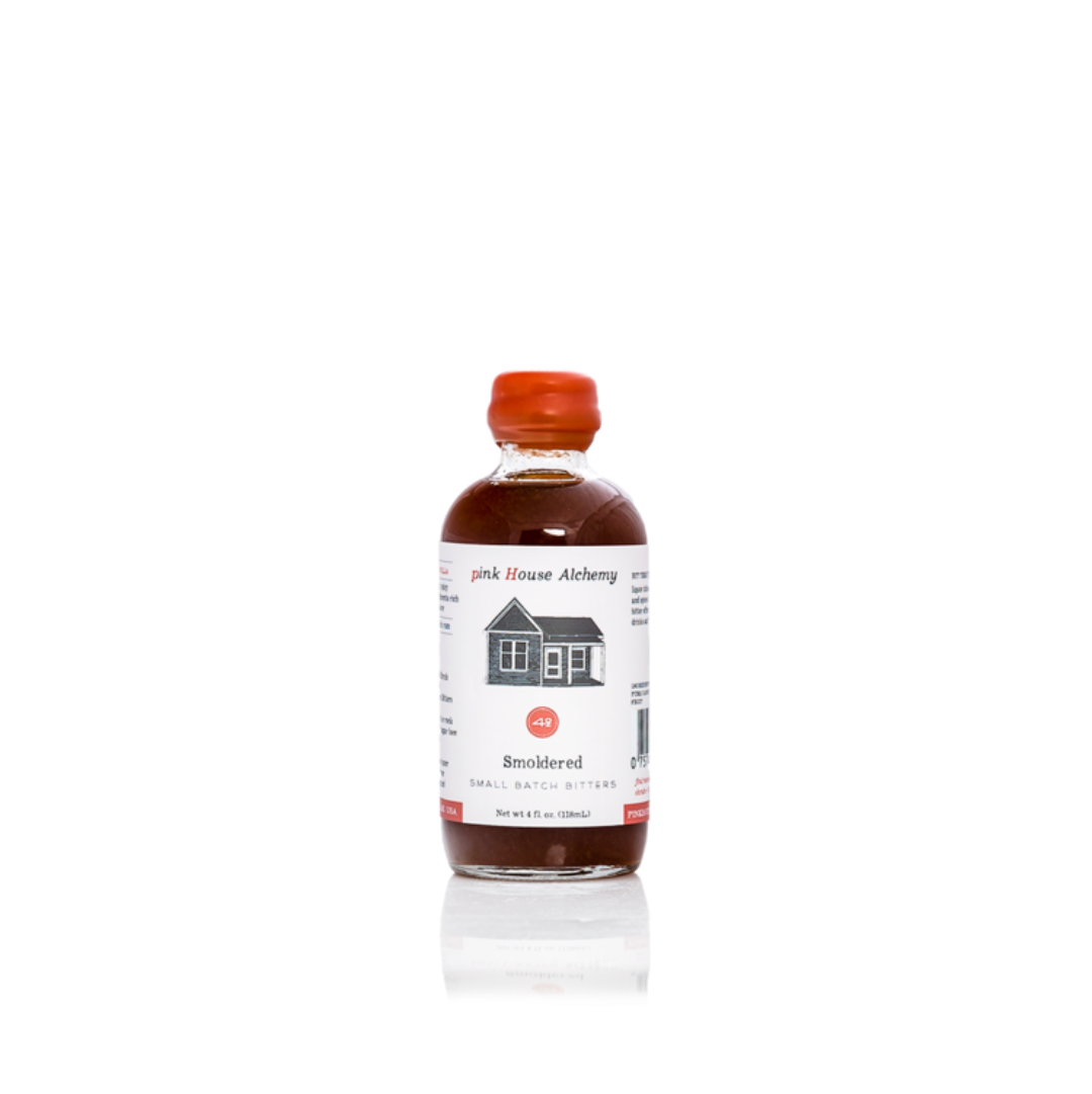 Bottle of Pick House Alchemy Smoldered small batch bitters on a white background