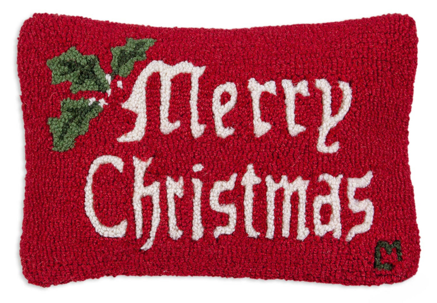 Red knitted pillow with 'Merry Christmas' text and holly leaves on a white background