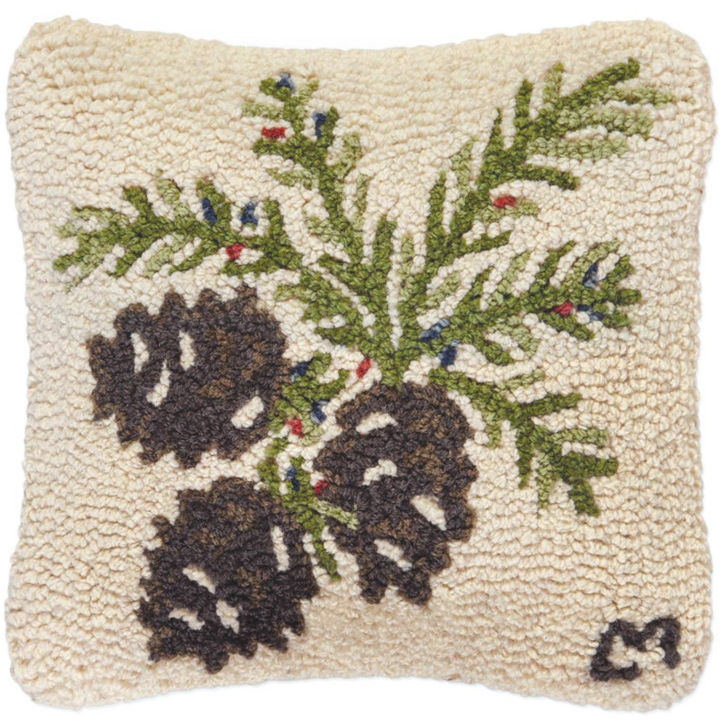 Decorative pillow with pinecones and greenery on a beige background