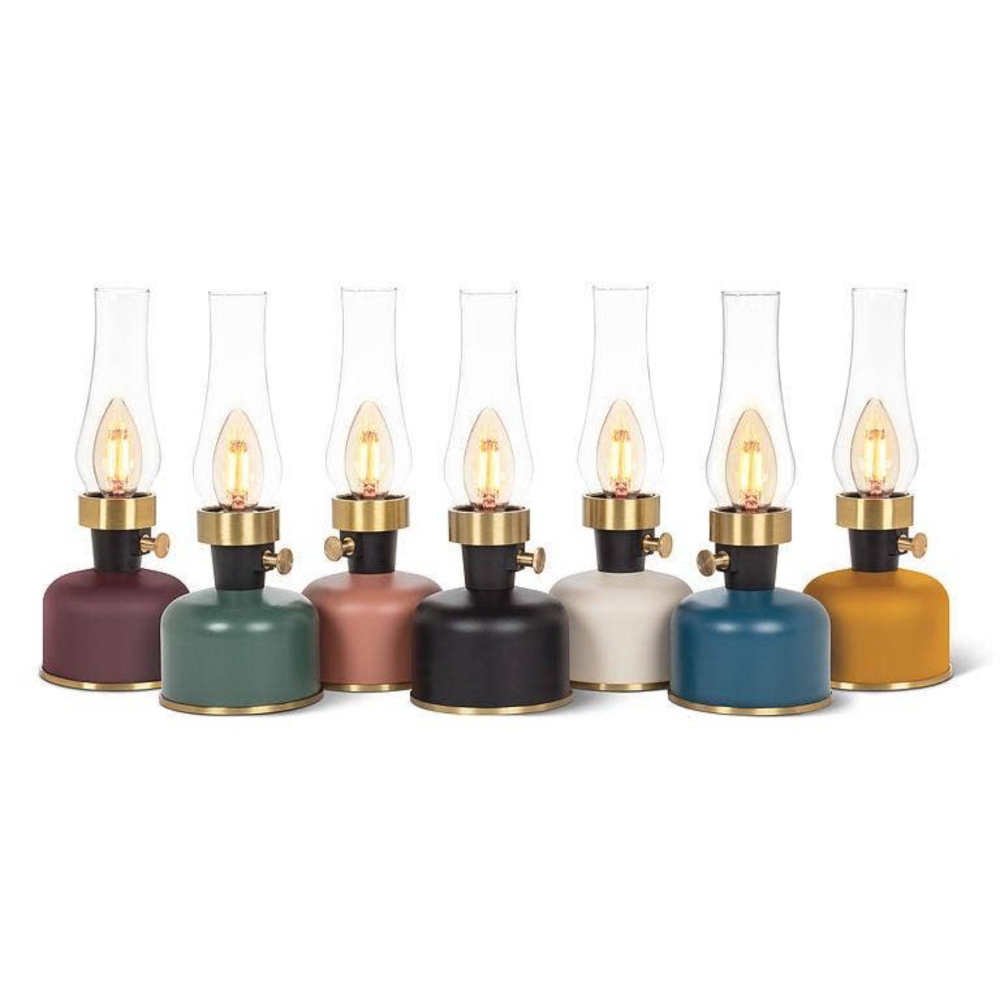 Set of colorful lanterns with lit candles on a white background
