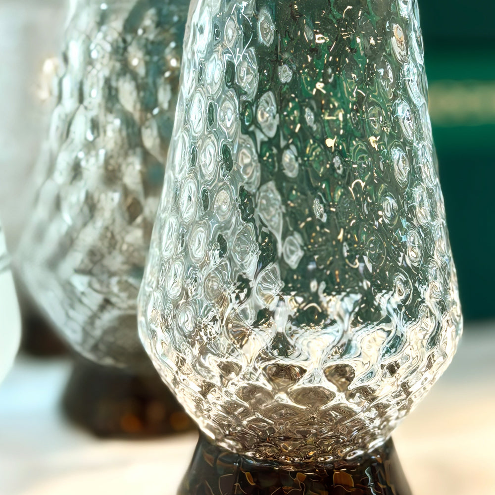 
                  
                    These exquisite glasses are hand-blown right here in the Pacific Northwest. Each of the three glasses is crafted using a unique mold, resulting in their distinct styles. Sold individually, you can assemble your own set.

The Hand-Blown Neat Pour Glass is meticulously crafted to amplify the aromatic notes of your selected spirit, ensuring an exquisite and immersive drinking experience. It is an ideal choice for a diverse range of beverages, including smooth scotch and aged tequila, as well as any other premi
                  
                