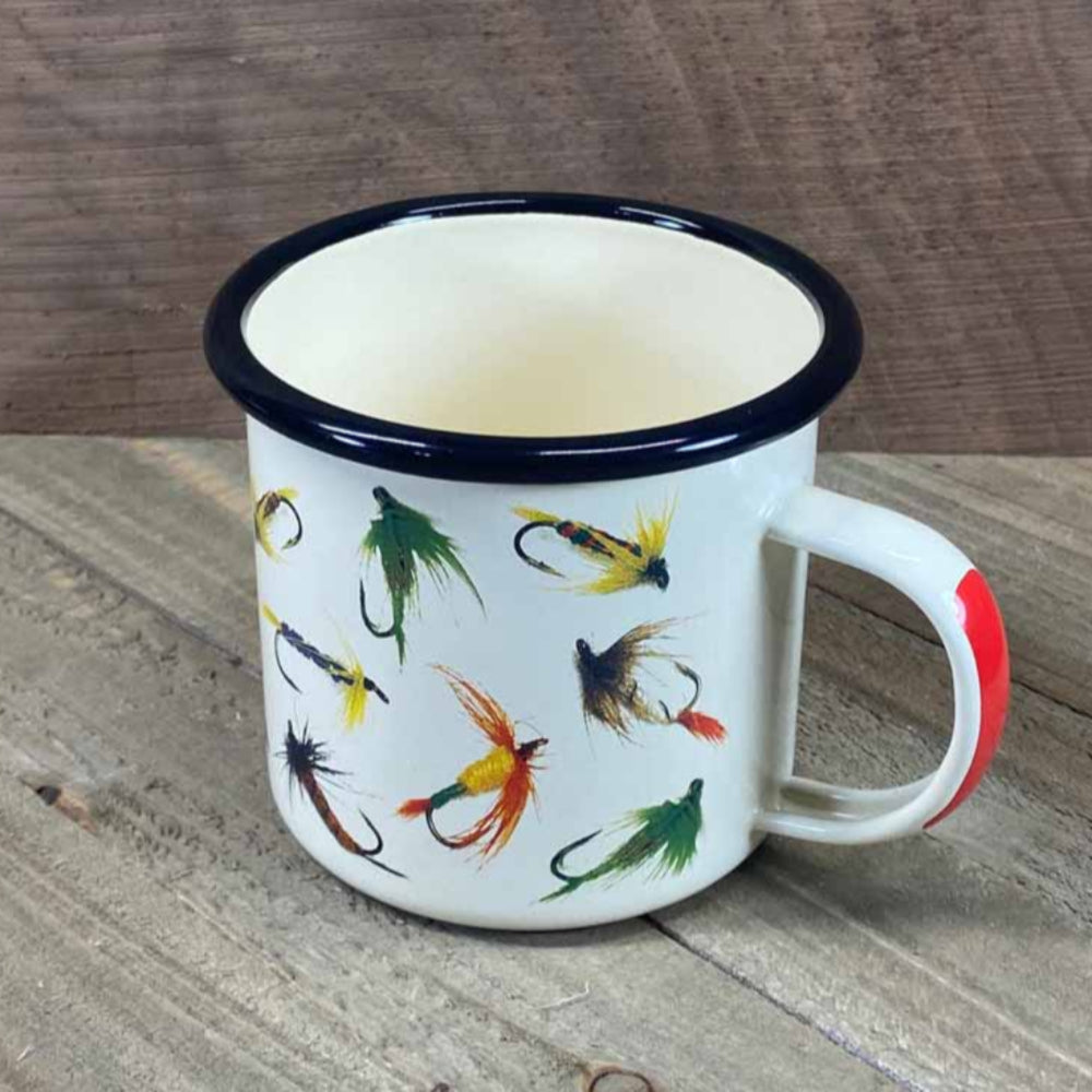 
                  
                    Bring a touch of nostalgia to your collection with this classic blue speckled camp-ware mug (enamel over steel) featuring a artisan detailed pattern of fishing flies on a cream-colored background. The red handle stripe and small graphic of a red hook with a line on the inner edge add to the charm of this functional mug, perfect for the great outdoors or cozy cabins and homes.
                  
                