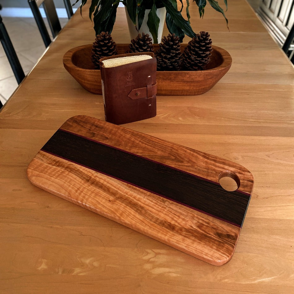 This eye-catching Charcuterie Board crafted from Tiger Heart Curly Maple, Purple Heart and Wenge adds a stylish touch to every tabletop. Make a lasting impression on your colleagues at the next get-together with this elegant serving board