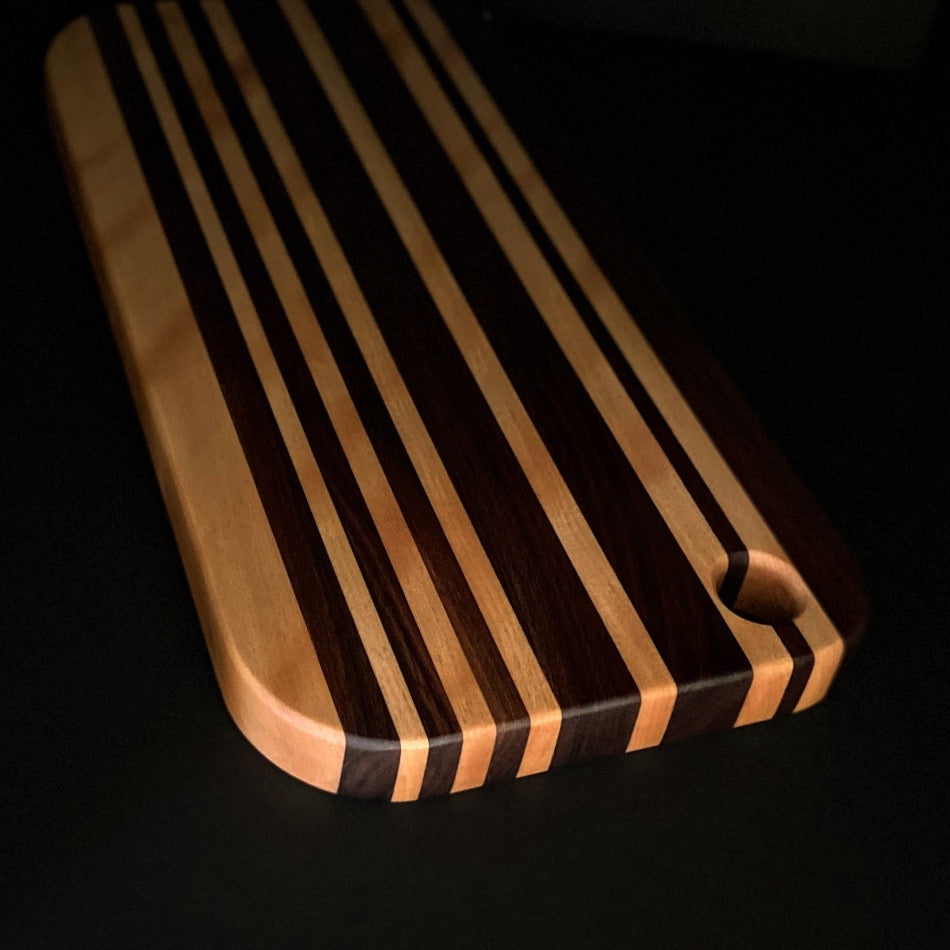 This awesome serving board or bread board is Handcrafted with Walnut & Curley Cherry. 