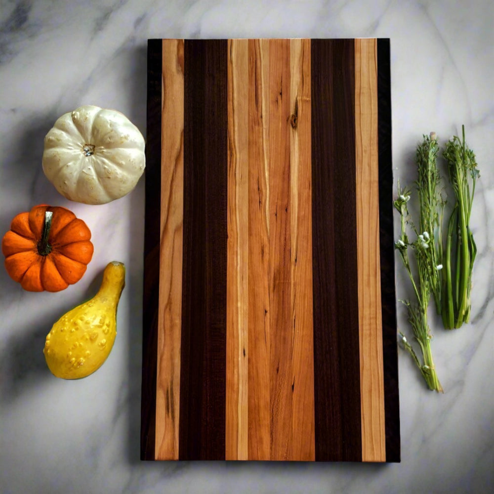 
                      
                        Simple and beautiful. This edge grain serving board is just that. Amazing Curly Cherry, Walnut, Tiger Heart Maple and Eastern Highly Figured Walnut resonates with family gatherings all year round, particularly this time of the year. Sutherland Welles Millie's All-Purpose Penetrating Tung Oil highlighted the artistic characteristics of mother nature.
                      
                    