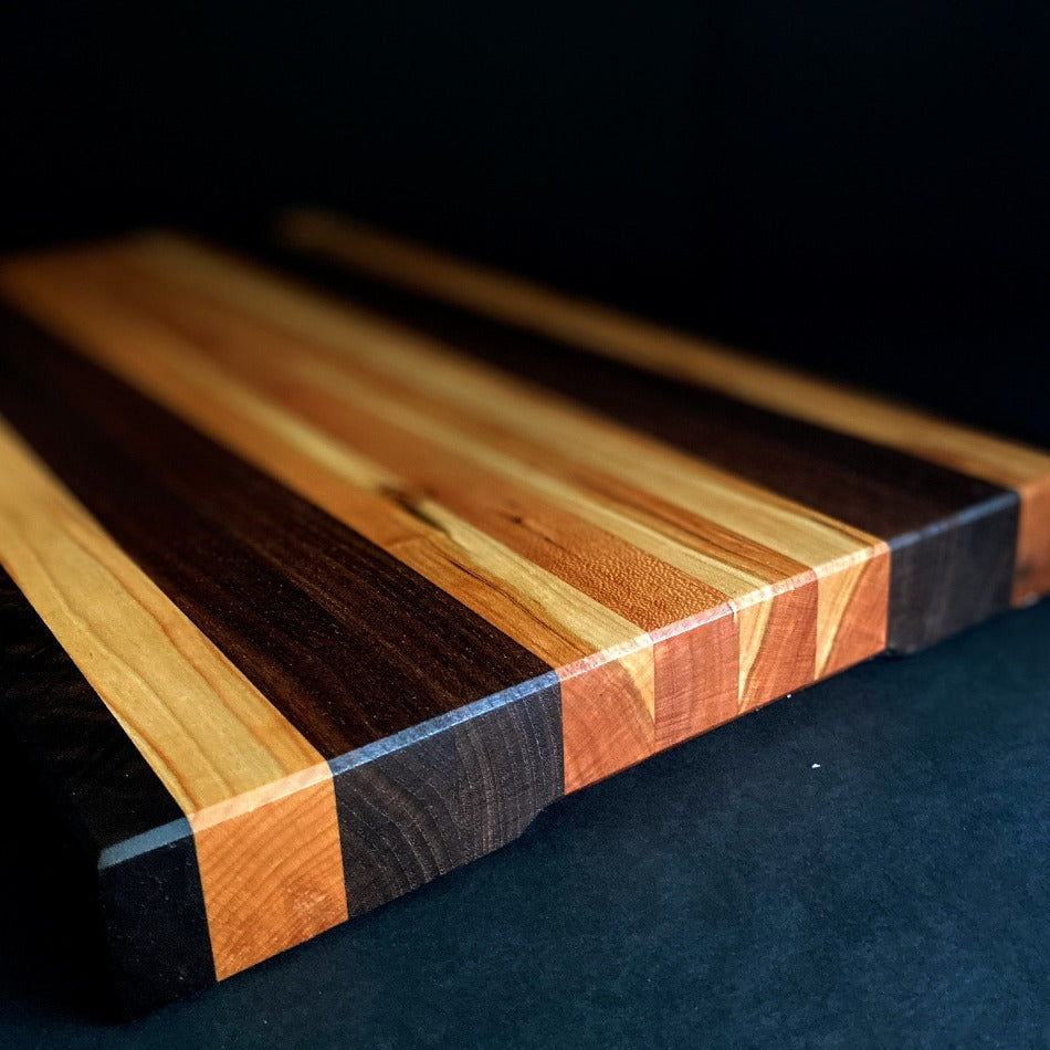 
                      
                        Simple and beautiful. This edge grain serving board is just that. Amazing Curly Cherry, Walnut, Tiger Heart Maple and Eastern Highly Figured Walnut resonates with family gatherings all year round, particularly this time of the year. Sutherland Welles Millie's All-Purpose Penetrating Tung Oil highlighted the artistic characteristics of mother nature.
                      
                    