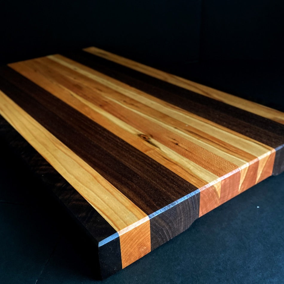 
                      
                        Simple and beautiful. This edge grain serving board is just that. Amazing Curly Cherry, Walnut, Tiger Heart Maple and Eastern Highly Figured Walnut resonates with family gatherings all year round, particularly this time of the year. Sutherland Welles Millie's All-Purpose Penetrating Tung Oil highlighted the artistic characteristics of mother nature.
                      
                    