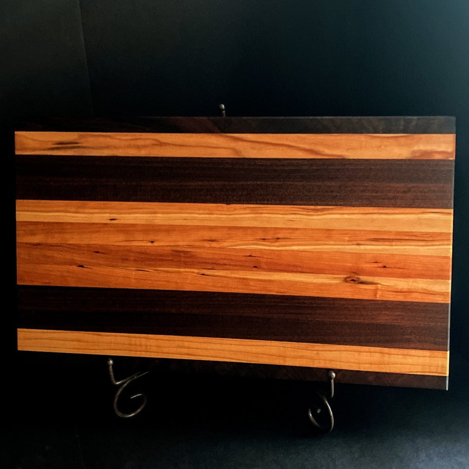 
                      
                        Simple and beautiful. This edge grain serving board is just that. Amazing Curly Cherry, Walnut, Tiger Heart Maple and Eastern Highly Figured Walnut resonates with family gatherings all year round, particularly this time of the year. Sutherland Welles Millie's All-Purpose Penetrating Tung Oil highlighted the artistic characteristics of mother nature.
                      
                    