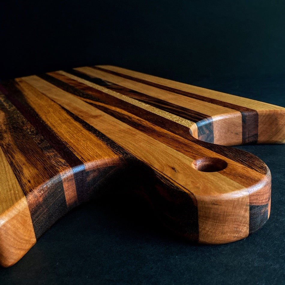 Simple and beautiful. This edge grain serving board is just that. Amazing Curly Cherry, Walnut, Tiger Heart Maple and Eastern Highly Figured Walnut resonates with family gatherings all year round, particularly this time of the year.