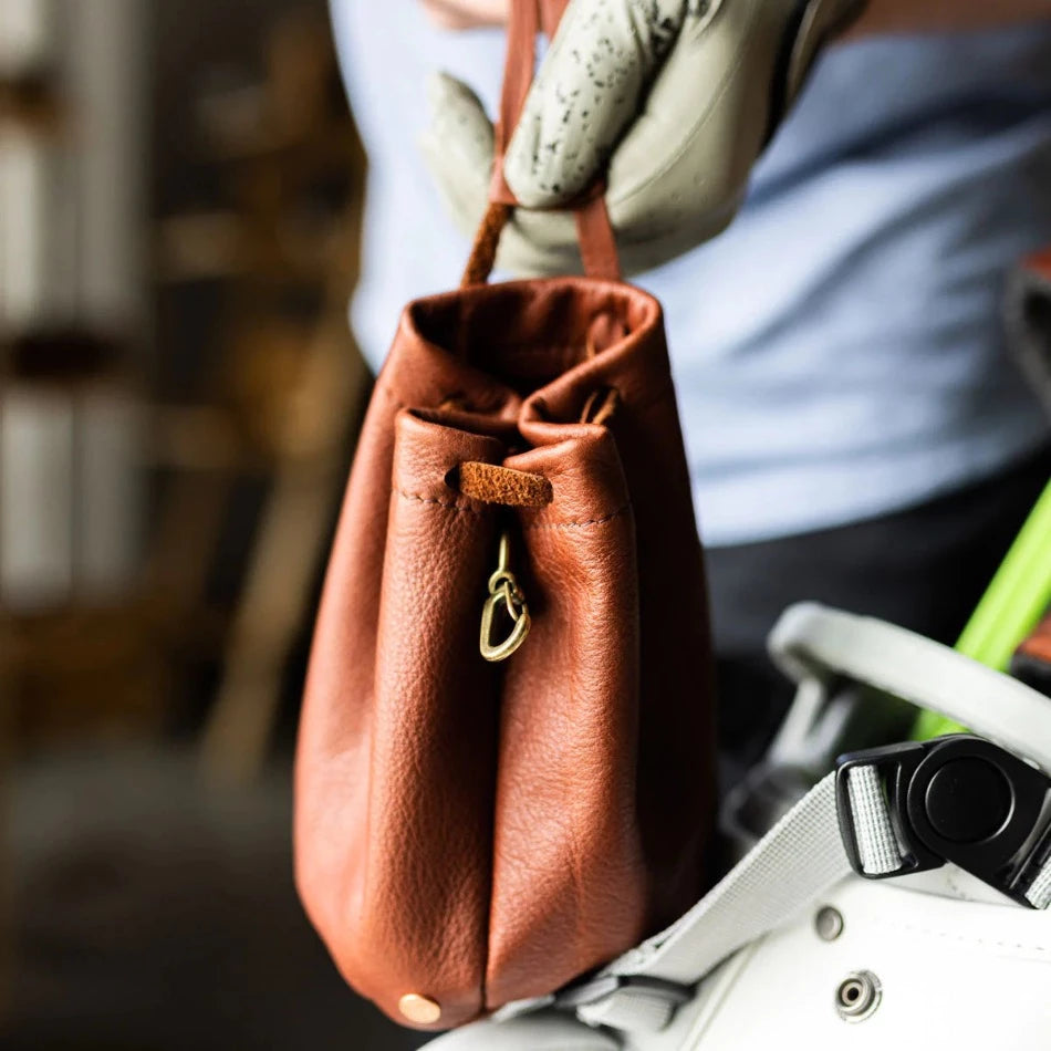 
                  
                    Handcrafted with pebbled leather and a drawcord closure, this golf pouch is the ideal spot to stash all your golfing goodies. Tuck away golf balls, tees, or whatever other teeny treasures you wanna keep close at hand. Problem solved!
                  
                