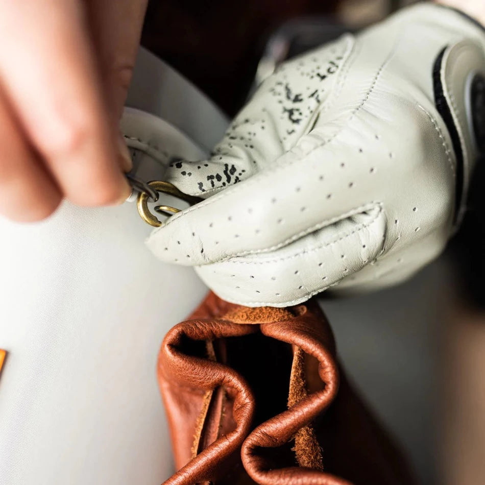 
                  
                    Handcrafted with pebbled leather and a drawcord closure, this golf pouch is the ideal spot to stash all your golfing goodies. Tuck away golf balls, tees, or whatever other teeny treasures you wanna keep close at hand. Problem solved!
                  
                