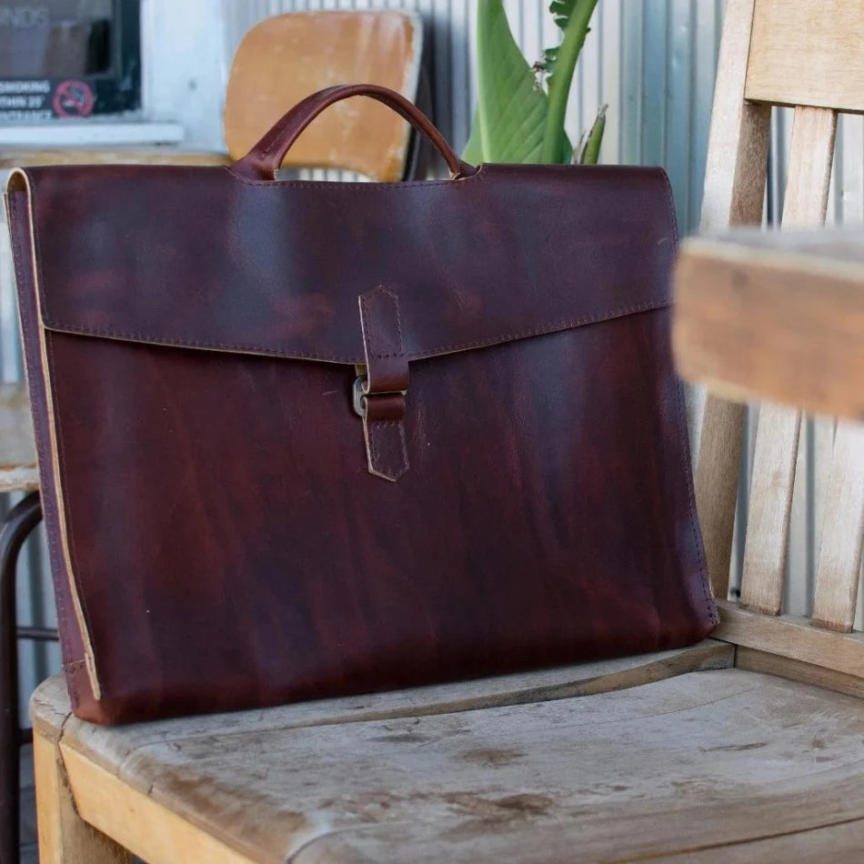 
                  
                    The Diplomat Attaché functions as a carry tool for a laptop, wallet, cell phone, and all your other accessories. It can be carried at your side by its reinforced leather handle or cross-body with the included shoulder strap for a sleek appearance. The top grain leather will keep your gear well protected while looking better over time.
                  
                