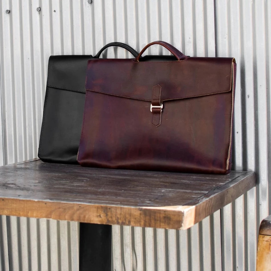 The Diplomat Attaché functions as a carry tool for a laptop, wallet, cell phone, and all your other accessories. It can be carried at your side by its reinforced leather handle or cross-body with the included shoulder strap for a sleek appearance. The top grain leather will keep your gear well protected while looking better over time.