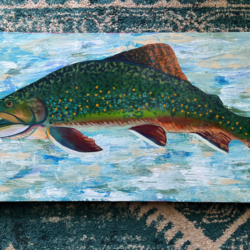 Art Bio: The Brook Trout. This work combines textures and techniques of acrylic painting to create a trout enveloped in an abstracted water space. The use of glazing creates a glow within the colors of the brook trout. All together the colors and techniques in this piece display the natural beauty of the brook trout.