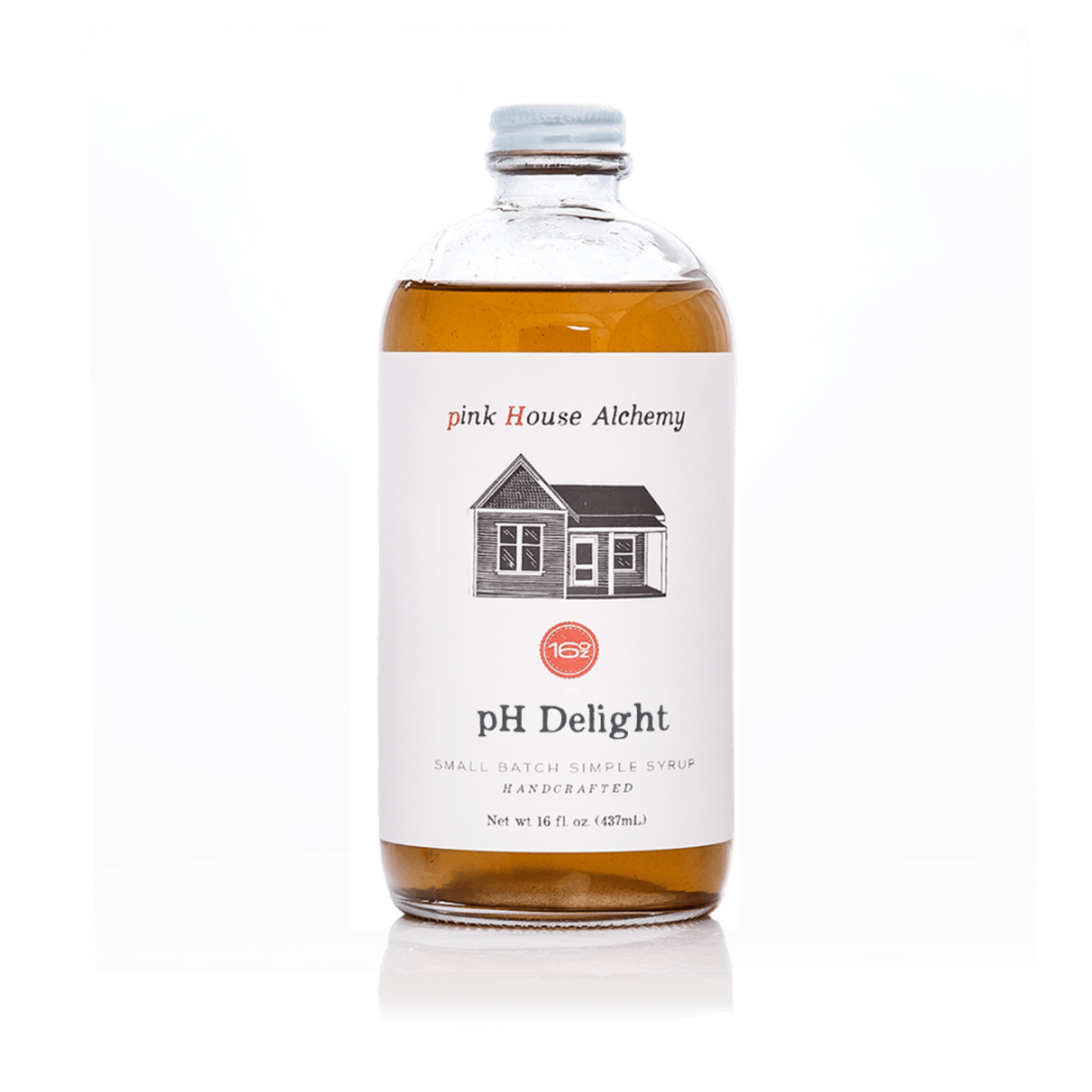 Bottle of pink House Alchemy pH Delight syrup on a white background