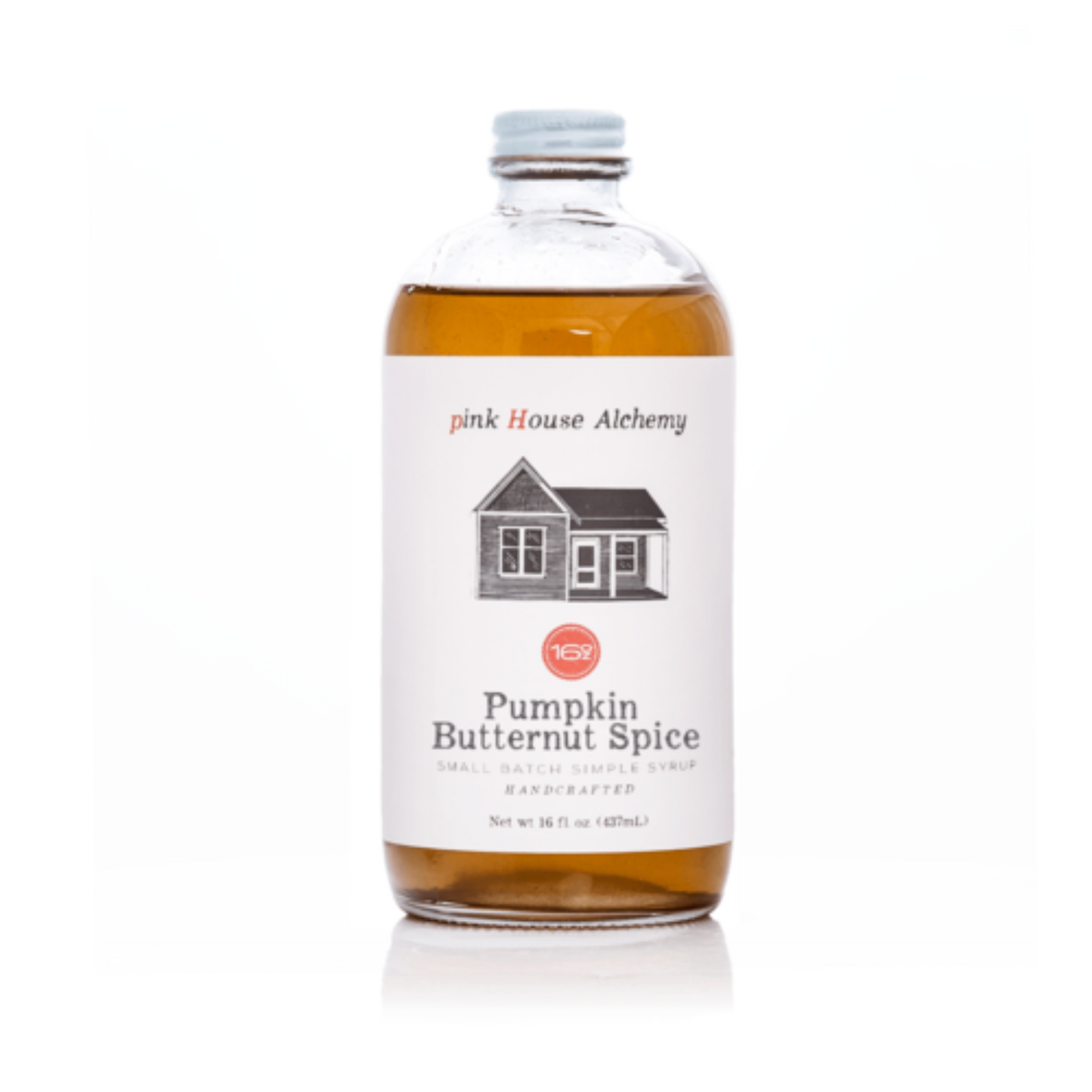 Bottle of Pumpkin Butternut Spice syrup from pink House Alchemy on a white background