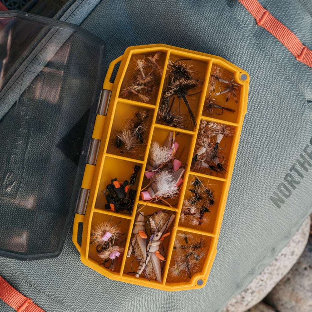 
                  
                    Quick access, effortless organization, and zero guesswork—the UPG Compartment Box is built for anglers who need their go-to patterns ready&nbsp;at a glance.

With 11 secure compartments and a clear lid, this box keeps a variety of flies neatly sorted and instantly visible, eliminating the frustration of digging through clutter.

Whether you’re storing match-the-hatch staples, trusted favorites, or fresh-off-the-vise creations, this box makes organization seamless.

It’s simple and efficient —the UPG Compart
                  
                