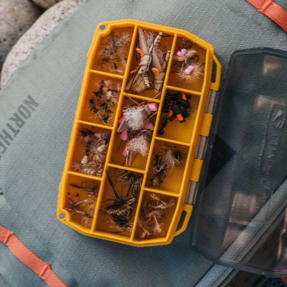 
                  
                    Quick access, effortless organization, and zero guesswork—the UPG Compartment Box is built for anglers who need their go-to patterns ready&nbsp;at a glance.

With 11 secure compartments and a clear lid, this box keeps a variety of flies neatly sorted and instantly visible, eliminating the frustration of digging through clutter.

Whether you’re storing match-the-hatch staples, trusted favorites, or fresh-off-the-vise creations, this box makes organization seamless.

It’s simple and efficient —the UPG Compart
                  
                
