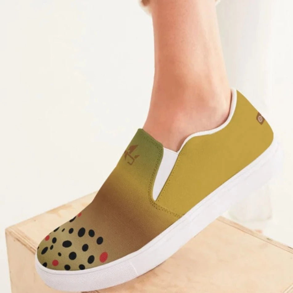 Women’s Browntown Smooth Slip-On Canvas This classic Women's Slip-On Canvas Shoe is an ideal choice for all-day wear. Crafted with removable soft insoles and rubber outsoles for easy on and off, it features breathable lining, elastic side accents, a padded collar and tongue, and is hand-printed and cut.  Fit Tip: True to Size