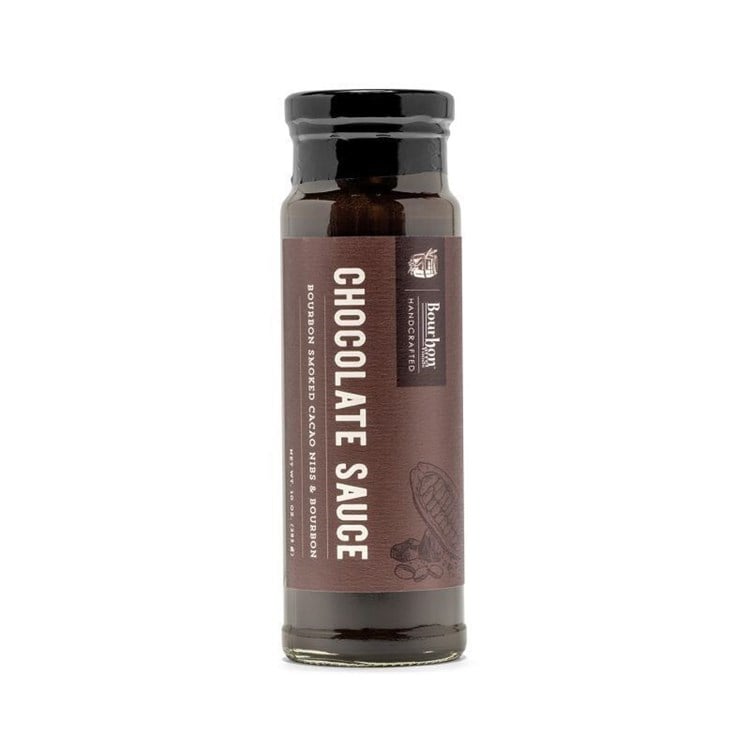 Bourbon Smoked Cacao Nibs add texture to this signature Chocolate Sauce. The sauce is both creamy and crunchy, as well as rich and bittersweet. Spoon it over ice cream or drizzle it on fruit.