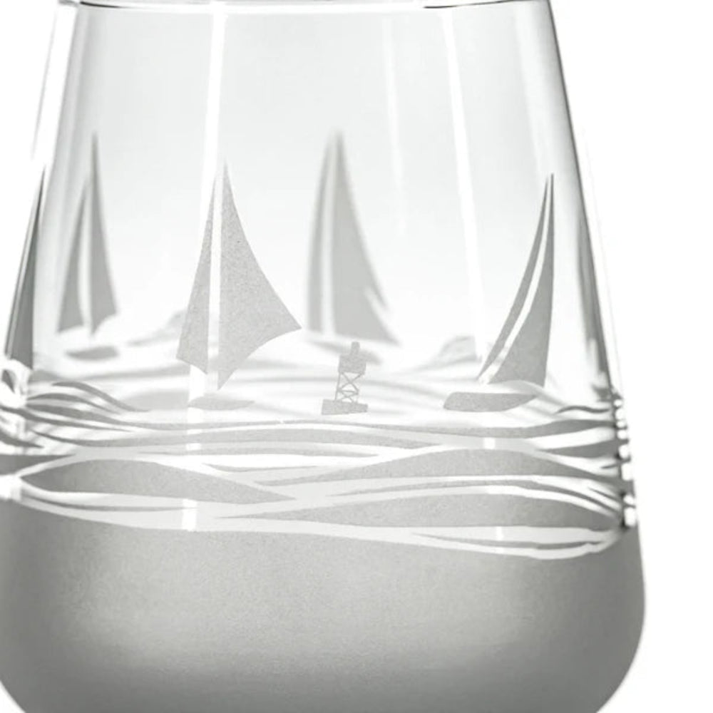 
                  
                    Experience the charm of the sea with every sip from our Regatta 15.75oz Stemless Wine Glass. This beautifully crafted glass features a sand-etched design of stylized sailboats, adding a touch of nautical elegance to your wine tasting experience. The stemless design ensures a comfortable grip, while the deep bowl allows you to appreciate the aroma of your favorite wines. Perfect for wine enthusiasts and nautical aficionados alike.
                  
                