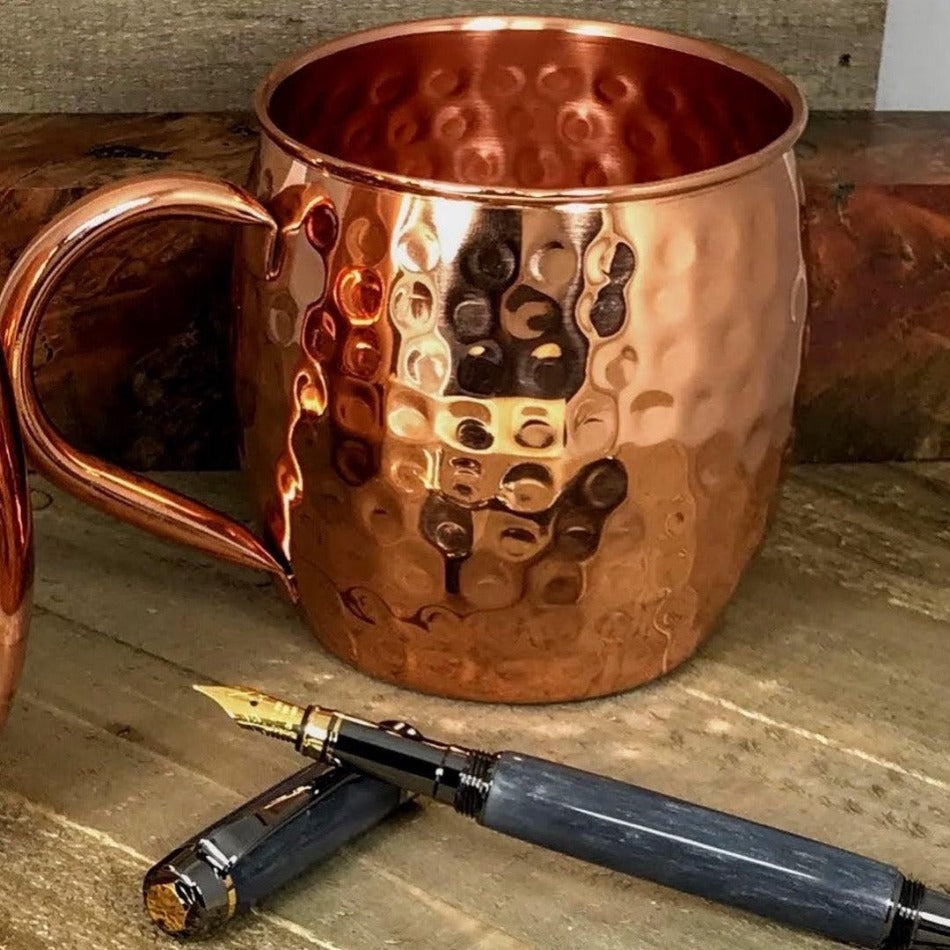 
                      
                        A timeless addition to any kitchen, this rustic mug features a hammered 100% copper barrel surface and oversized, rounded copper handle. Made from 22-gauge pure copper, it's a statement of style and quality. Barrel Hammered Copper Cup - Fish On! Custom Rods
                      
                    