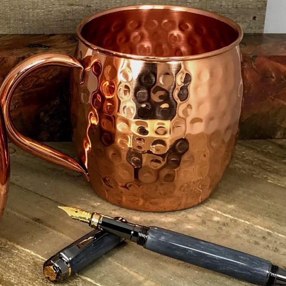 
                  
                    A timeless addition to any kitchen, this rustic mug features a hammered 100% copper barrel surface and oversized, rounded copper handle. Made from 22-gauge pure copper, it's a statement of style and quality. Barrel Hammered Copper Cup - Fish On! Custom Rods
                  
                