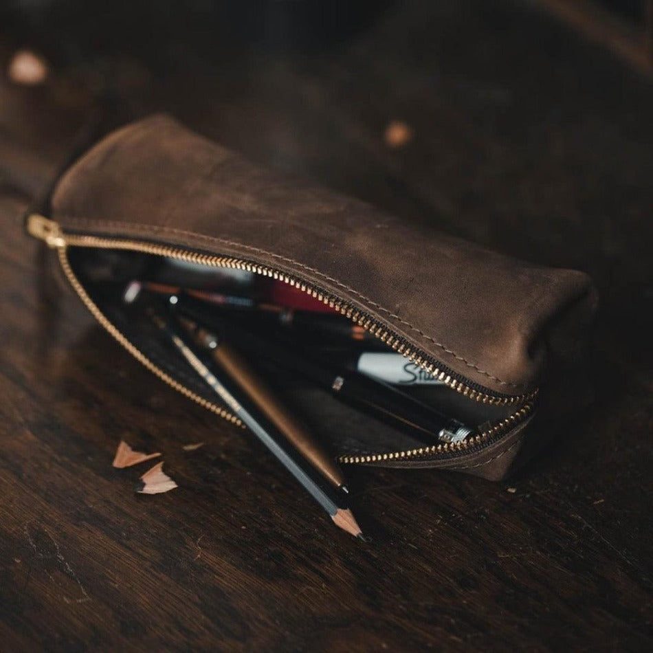 
                  
                    Experience luxury and reliability with High Line Leather Pouch. Crafted with premium-grade leather and robust brass zippers, this pouch comes in three sizes to suit your lifestyle. Whether for the office, an outdoor adventure, or traveling the globe, this pouch will keep your things protected and stylishly stored.
                  
                