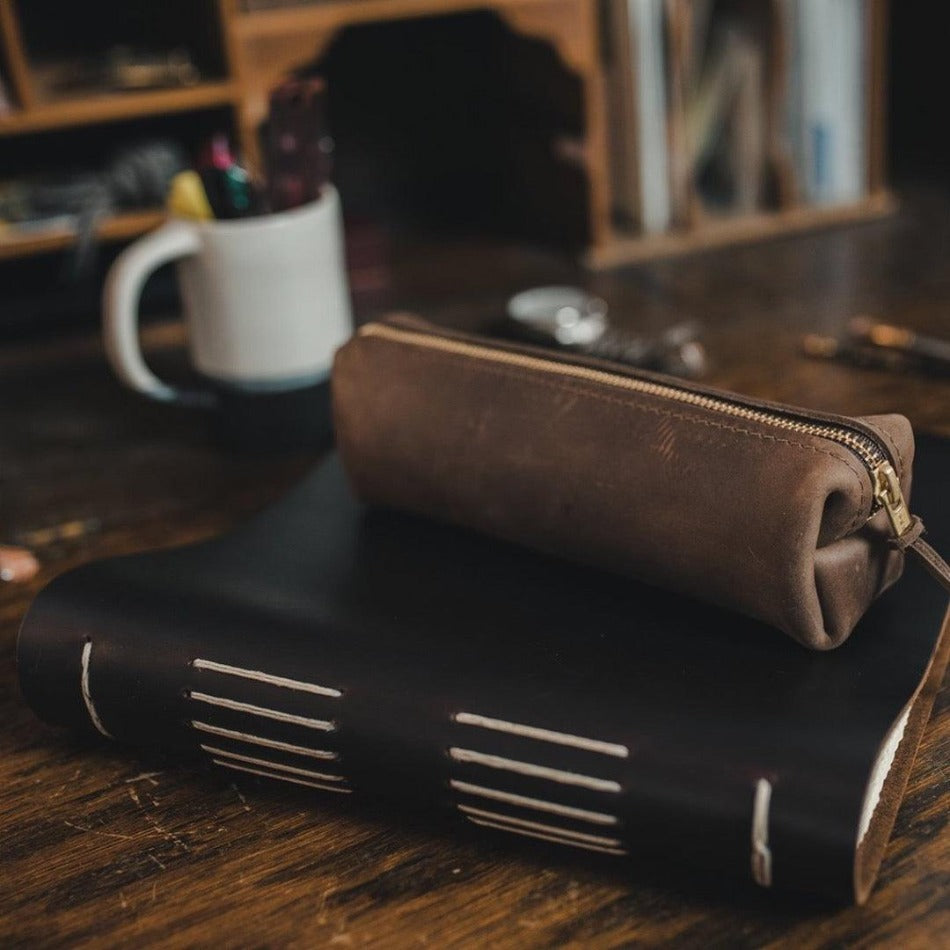 
                  
                    Experience luxury and reliability with High Line Leather Pouch. Crafted with premium-grade leather and robust brass zippers, this pouch comes in three sizes to suit your lifestyle. Whether for the office, an outdoor adventure, or traveling the globe, this pouch will keep your things protected and stylishly stored.
                  
                