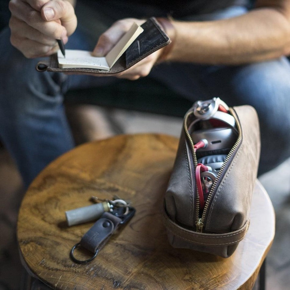 
                  
                    Experience luxury and reliability with High Line Leather Pouch. Crafted with premium-grade leather and robust brass zippers, this pouch comes in three sizes to suit your lifestyle. Whether for the office, an outdoor adventure, or traveling the globe, this pouch will keep your things protected and stylishly stored.
                  
                