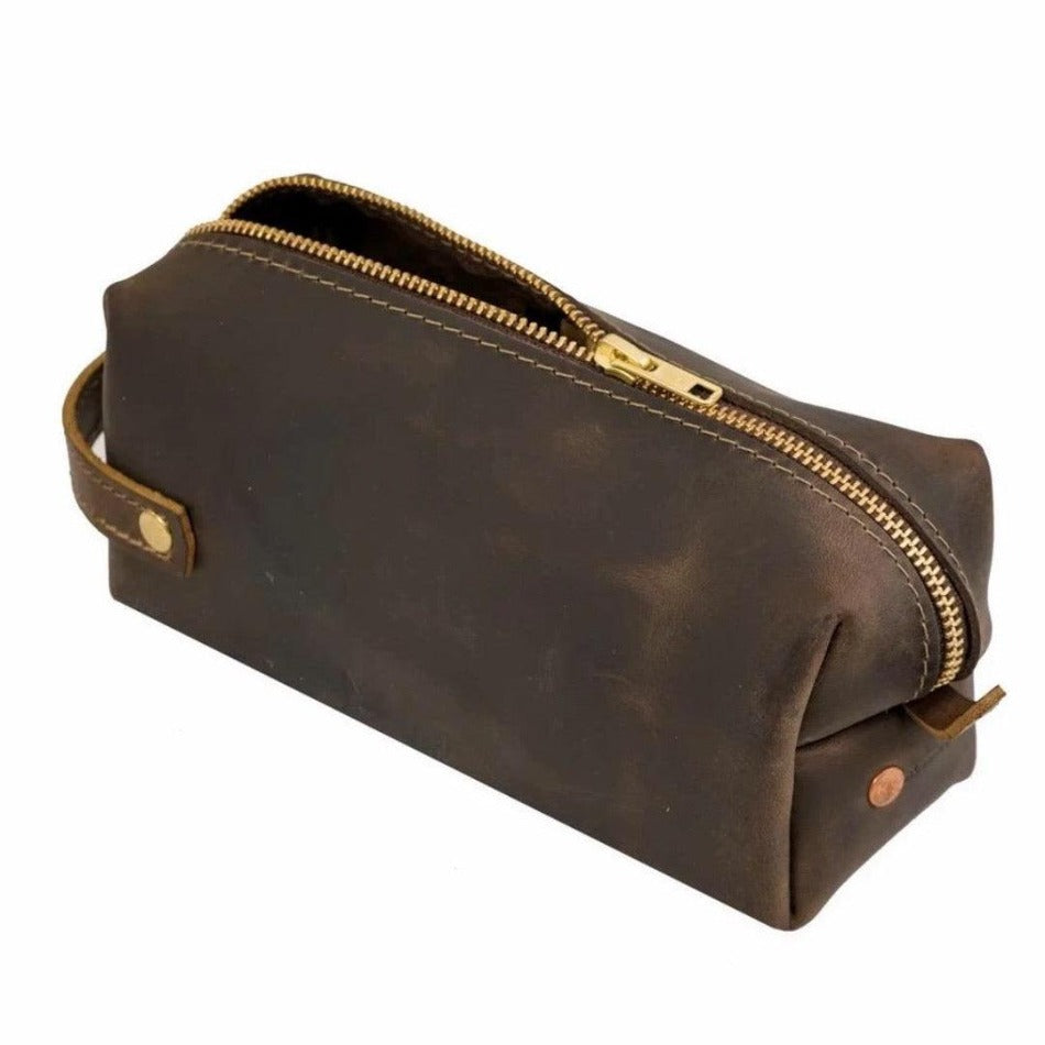 
                  
                    Experience luxury and reliability with High Line Leather Pouch. Crafted with premium-grade leather and robust brass zippers, this pouch comes in three sizes to suit your lifestyle. Whether for the office, an outdoor adventure, or traveling the globe, this pouch will keep your things protected and stylishly stored.
                  
                