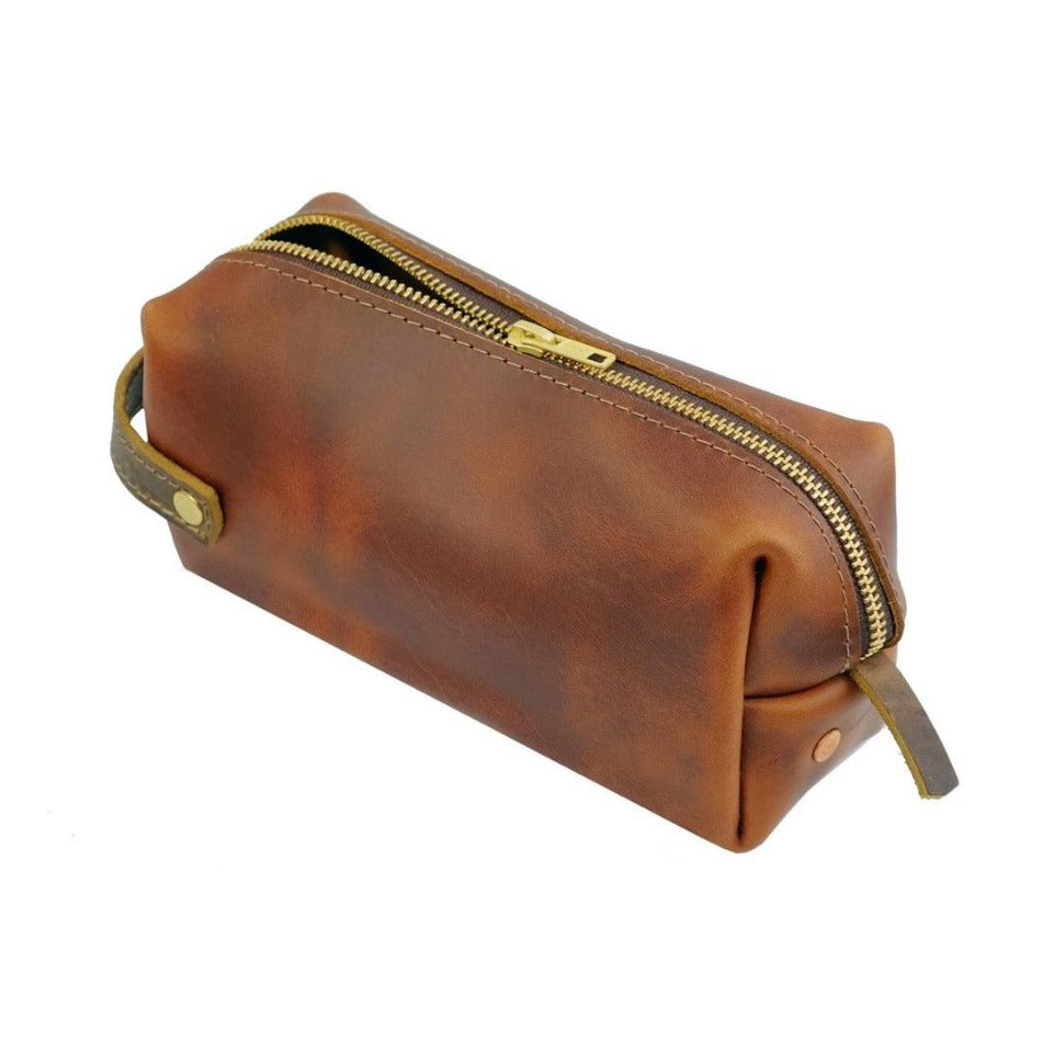 
                  
                    Experience luxury and reliability with High Line Leather Pouch. Crafted with premium-grade leather and robust brass zippers, this pouch comes in three sizes to suit your lifestyle. Whether for the office, an outdoor adventure, or traveling the globe, this pouch will keep your things protected and stylishly stored.
                  
                
