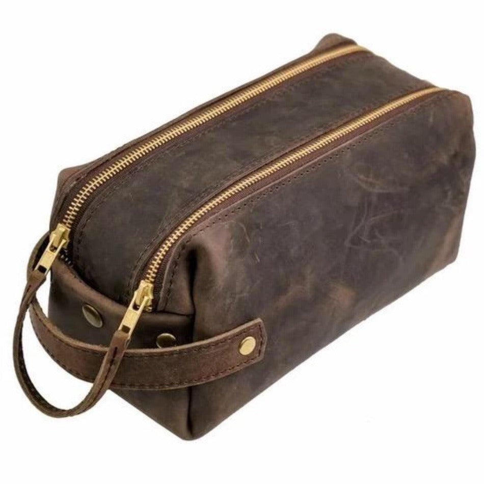 
                  
                    Experience luxury and reliability with High Line Leather Pouch. Crafted with premium-grade leather and robust brass zippers, this pouch comes in three sizes to suit your lifestyle. Whether for the office, an outdoor adventure, or traveling the globe, this pouch will keep your things protected and stylishly stored.
                  
                