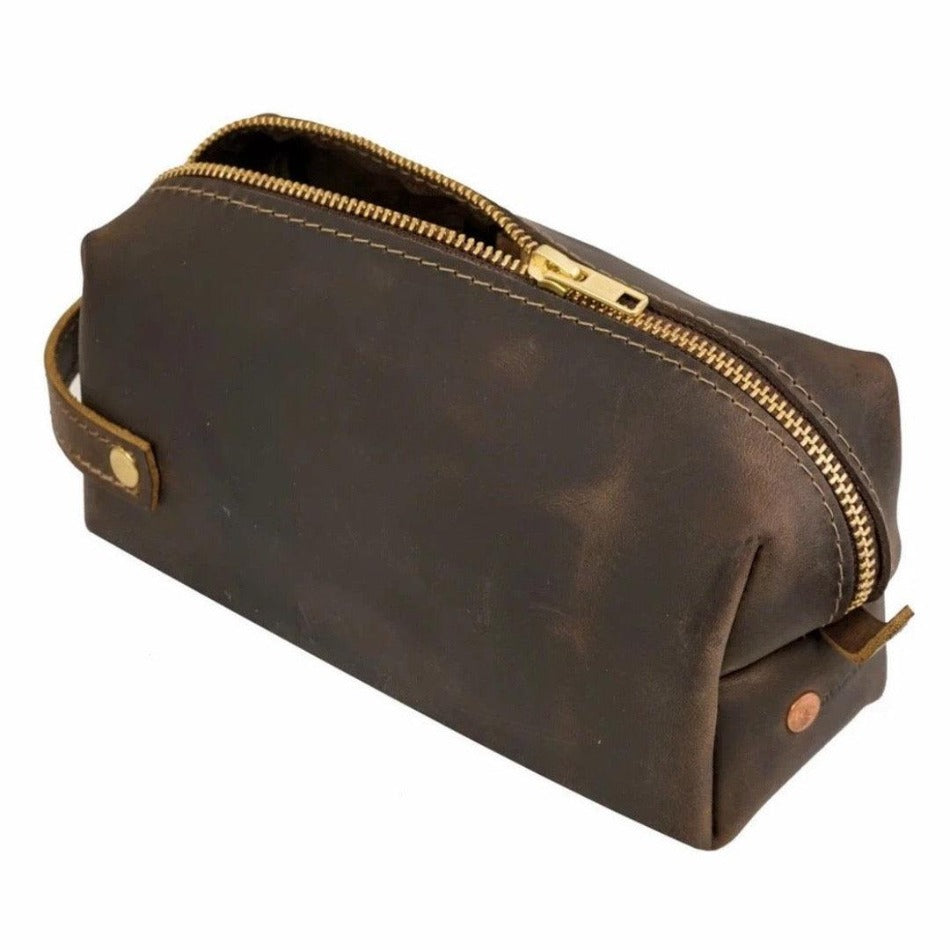 
                  
                    Experience luxury and reliability with High Line Leather Pouch. Crafted with premium-grade leather and robust brass zippers, this pouch comes in three sizes to suit your lifestyle. Whether for the office, an outdoor adventure, or traveling the globe, this pouch will keep your things protected and stylishly stored.
                  
                