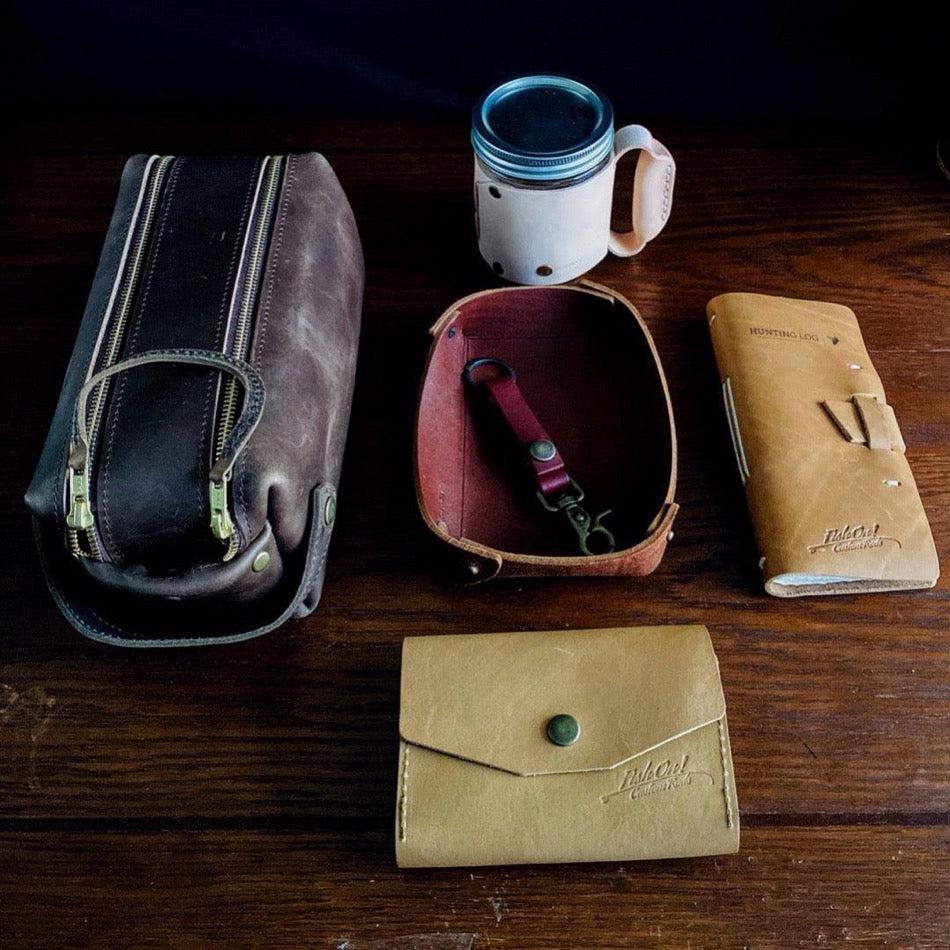 
                  
                    Leather Hunting Journal Early season or better yet preseason or scouting, our Leather Hunting Journal is a great tool for keeping up with key observations, weather conditions, morning or evening and most importantly, your first hunt with your son or daughter.  Designed to be used on any type of hunt, this leather journal is a outdoors enthusiast partner, soon to be filled with memories of a lifetime.   3.75" x 1" x 8" Includes 96 printed rough-cut cream-colored pages
                  
                